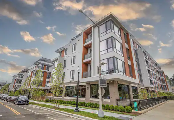 Park Morton, a modern multi-story residential apartment building with contemporary architecture and large glass windows.