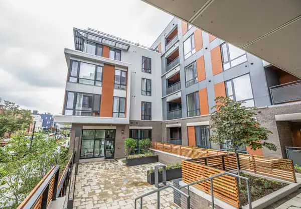 Park Morton, a contemporary multi-story apartment building with modern architecture and outdoor communal space.